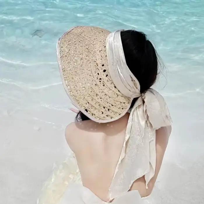 Chapeau de soleil élégant en raphia ajouré pour femme