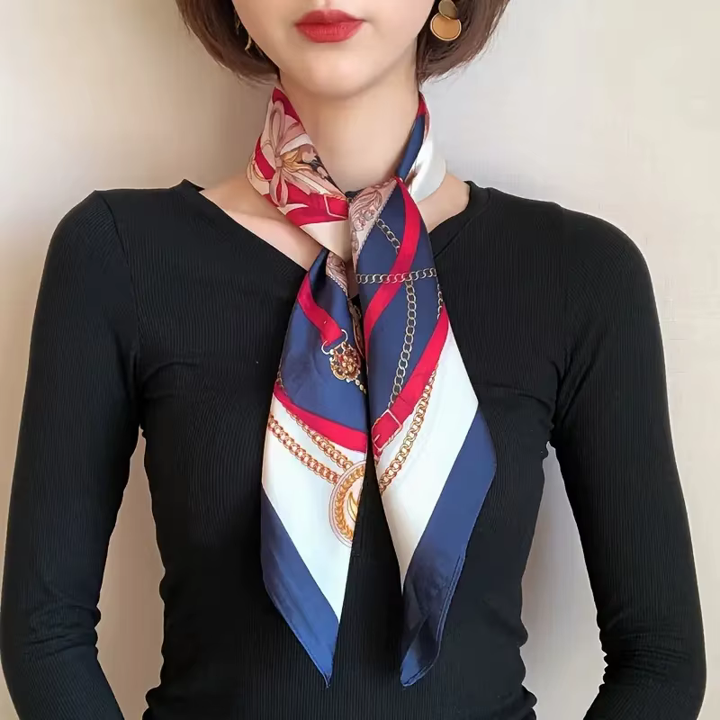 Une écharpe carrée avec un motif de boutons en cuir